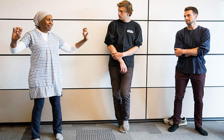 Academy member Carol Miller, MD, professor of Pediatrics, and director of Pediatric Primary Care and the Well Baby Nursery, demonstrates a Tai Chi movement for first-year medical students Bennett Kissel, center, and Michael Dodge as part of the wellness classes offered through the ARCH program, held in the Teaching and Learning Center, on the Parnassus campus.