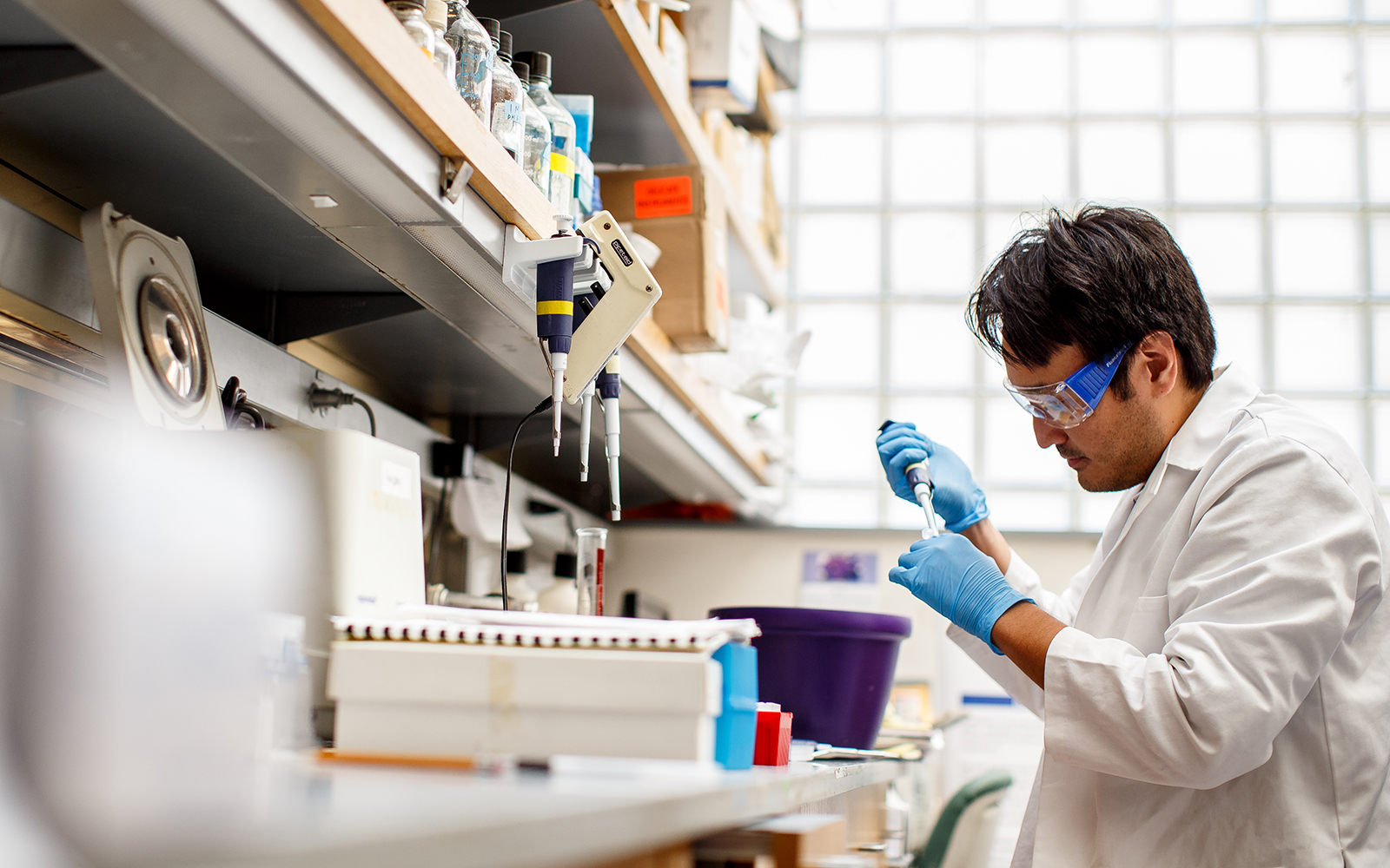 Researcher holds a pipette