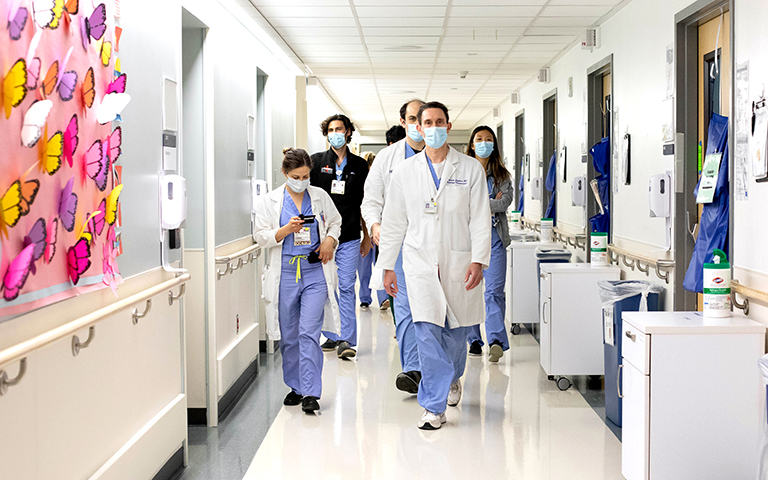 Photo by: Susan Merrell; After two months of quarantine, medical students go on rounds in the UCSF Intensive Care Unit at Parnassus.