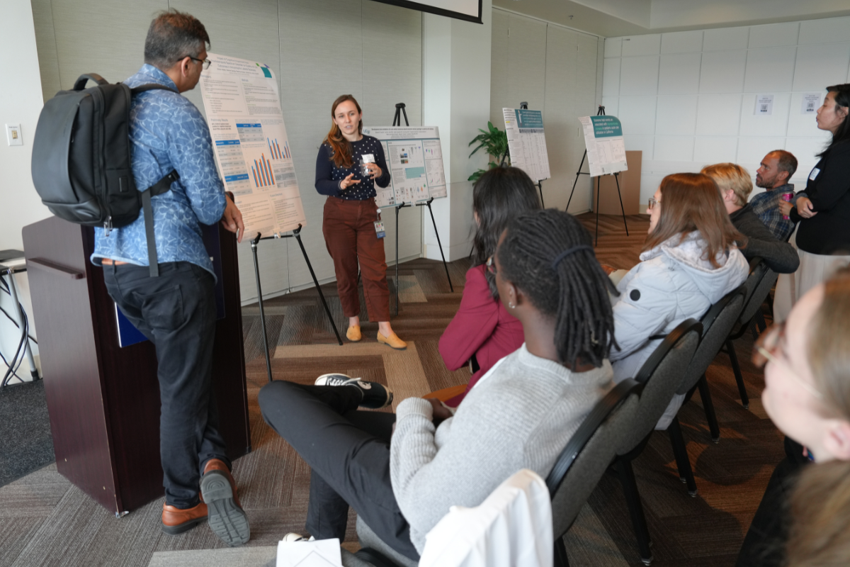 People in Conversation at a Poster Session at the Spring Inquiry Symposium