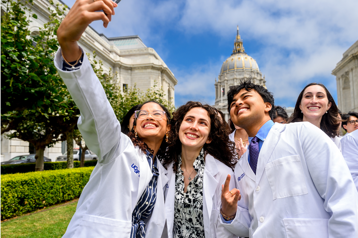 UCSF Medical Students pose for a selfie at the 2026 White Coat Ceremony