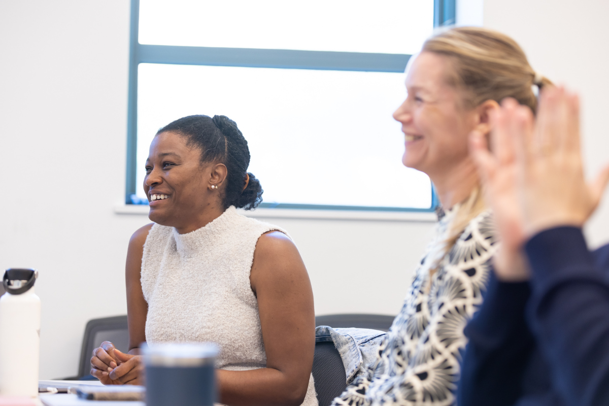 Two people seated in a worksession
