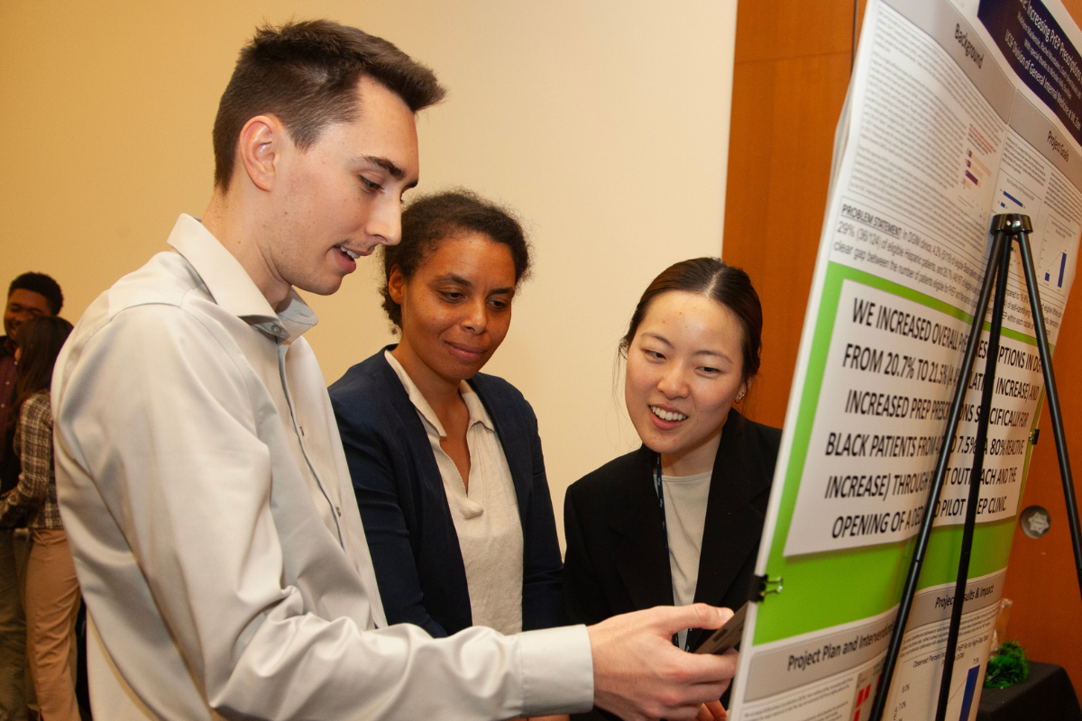 Students in discussion during a poster session