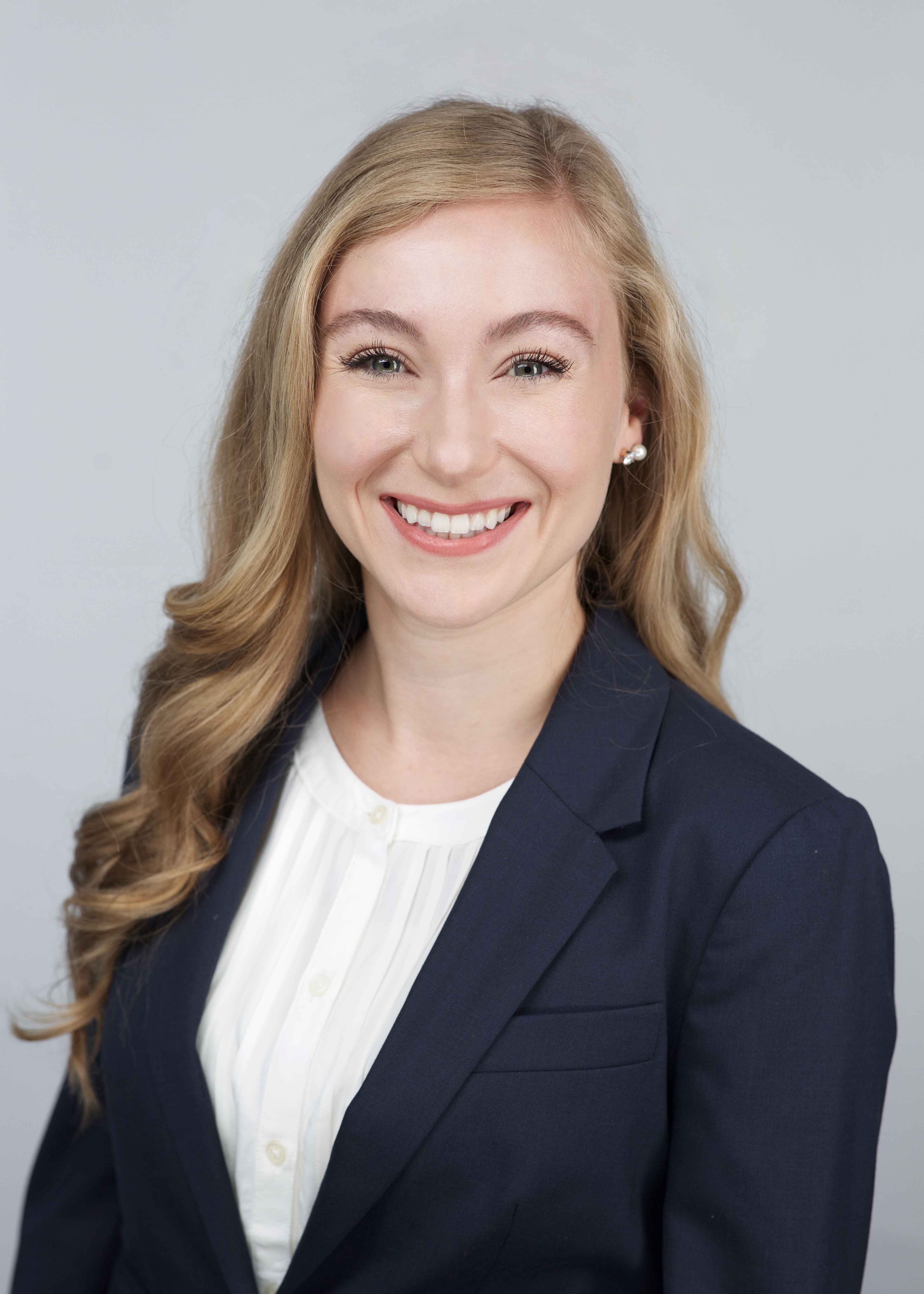 professional headshot of a person smiling