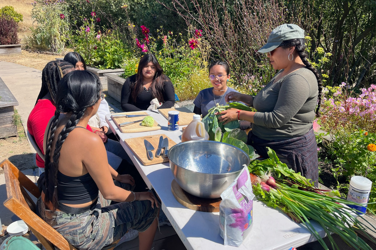 Alondra Aragon leads campers in traditional food-making sessions