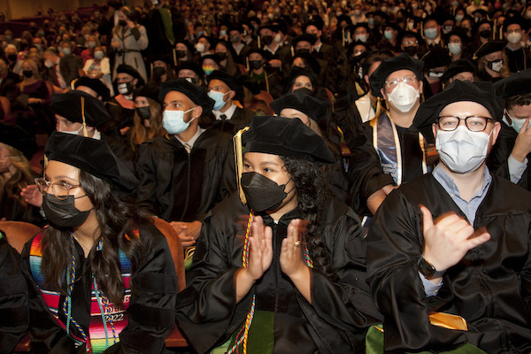 Students applaud during the ceremony