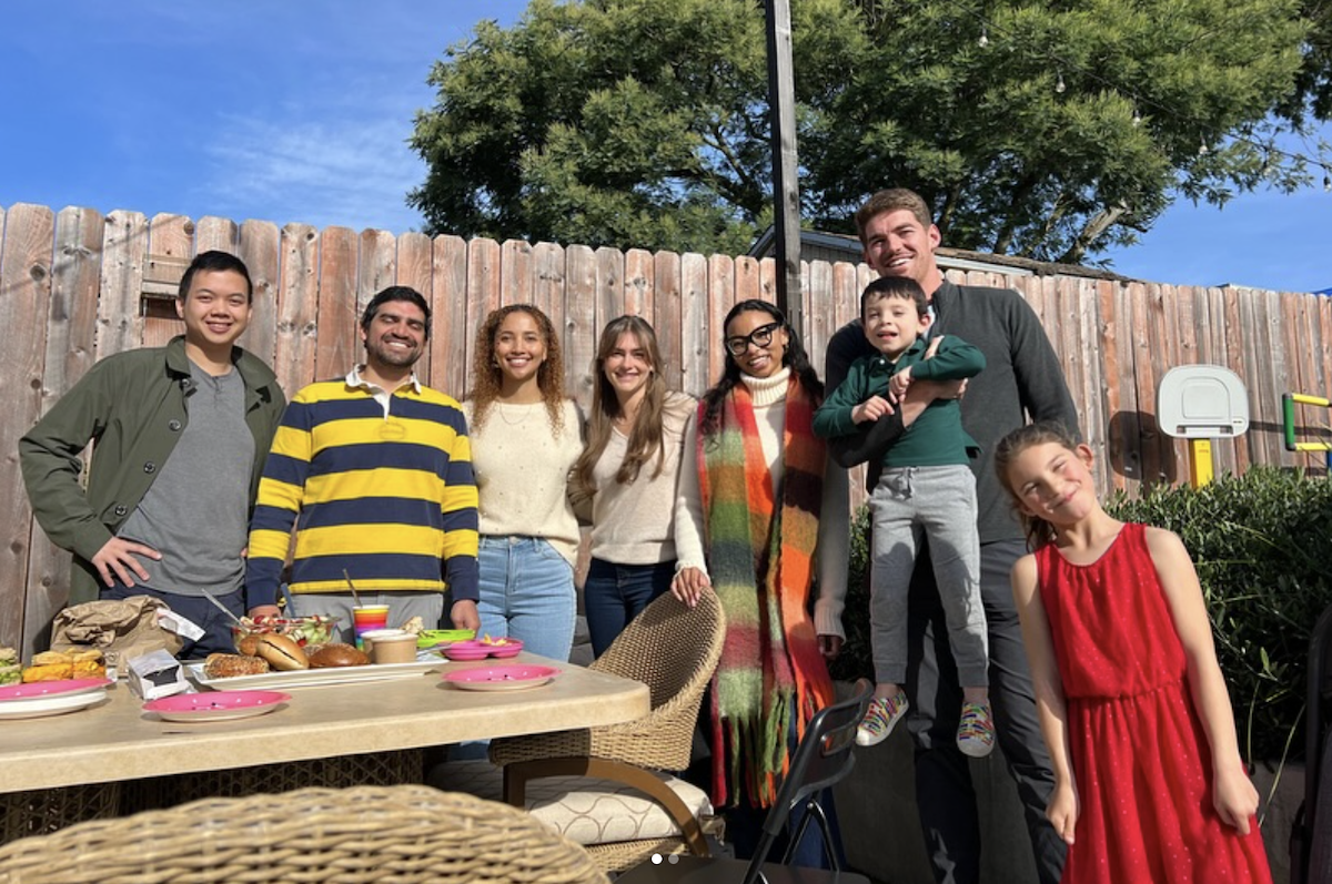 Andrew Pham, MS2, coach Josué Zapata, MD, Sydni Sheff, MS2, Caitlin Hendricks, MS2, Korena Boyd, MS2, Samuel Sheridan, MS2, Rafael Zapata (4), and Sofia Zapata (9) gather for a picnic