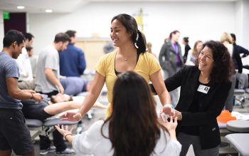 Dr. Kimberly Topp, right, chair of Physical Therapy and Rehabilitation Science, works with first-year doctor of physical therapy student Mara Mukai in the Clinical Skills Center (CSC) on Tuesday, Jan. 19, 2015, in San Francisco. Photo by Noah Berger.