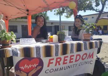 Bernadette Lim (left) volunteering at the Freedom Community Clinic, a clinic she founded in 2019.