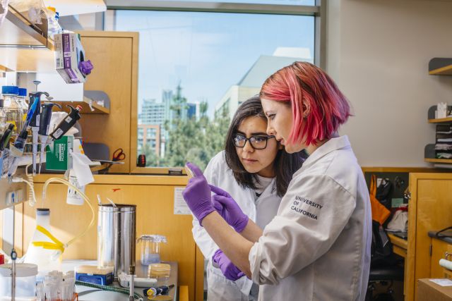 Graduate students Beatriz Osuna (left) and Adair Borges (right) from the Joe Bondy-Denomy lab in Mission Bay.